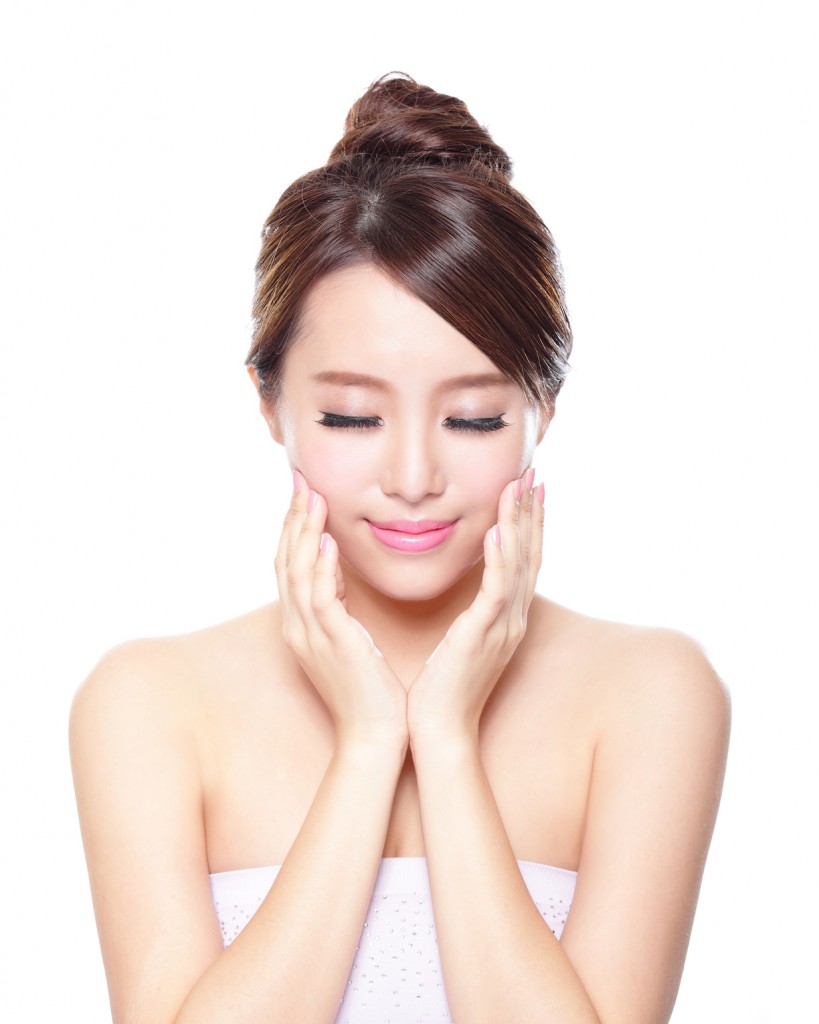 Beautiful woman smile face with clean face skin, and closed eyes , concept for eye and skin care, asian